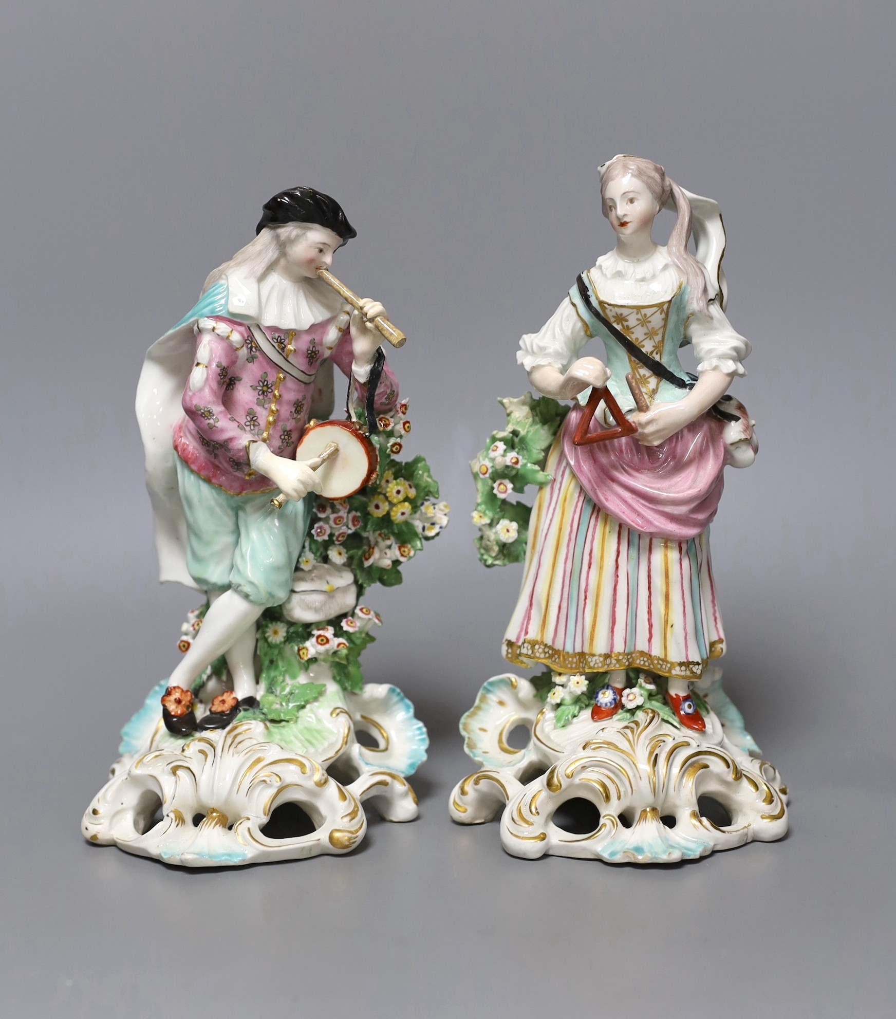 A pair of Derby figures of musicians, he playing the pipe and she playing the triangle, c.1765-70, patch marks, 21cm